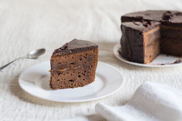 A slice of delicious chocolate cake. Piece of Cake on a Plate. Sweet food. Sweet dessert. Selective focus.