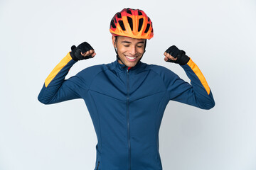 Young cyclist Brazilian man isolated on white background doing strong gesture - obrazy, fototapety, plakaty