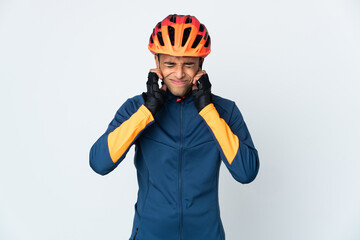 Young cyclist Brazilian man isolated on white background frustrated and covering ears
