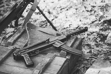 Old Soviet Russian Red Army Submachine Gun PPS-43 Weapon Gun Of World War II Lying On The Wooden Box. Black And White Photo