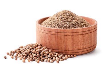 Dry coriander seeds and ground in a plate on a white background. Isolated