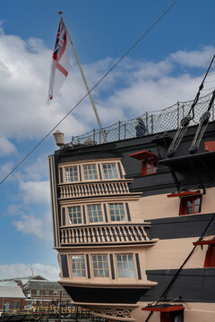 04-08-2021 Portsmouth, Hampshire, UK the rear of HMS Victory nelsons flagship with the white Ensign flag flying