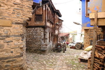 selective focus. old tractors and old village houses in Bursa in Turkey's history has been abandoned.