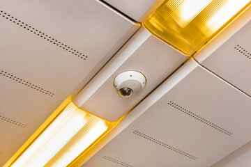 Surveillance camera on the ceiling of a modern electric train
