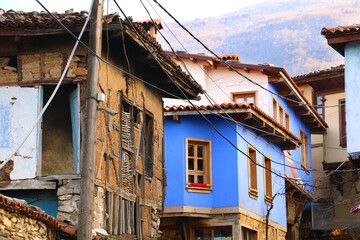 selective focus. Colorful houses in Bursa's old Cumalıkızık historical narrow streets.
