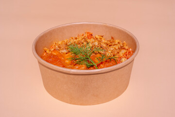 Eating diet concept. Buddha Poke Bowl Of Shrimp, Rice, Dry Onion. Lunch break. Close up, copy space, top view. Isolated on pink background