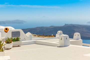Greece Santorini island in Cyclades, traditional detail sights of colorful flowers with pots and...