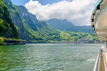 View of Swiss vilage or lakeshore from boat near Lucerne, Switzerland