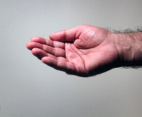 Isolated profile of a Middle Eastern man's right hand open upwards.