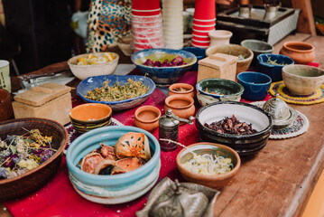 aromatic herbs, spices, tea in beautiful earthenware in a tea room