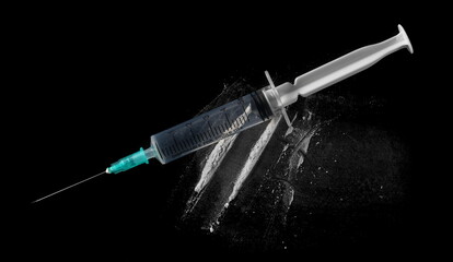 Medical syringe, needle and cocaine lines isolated on black background, clipping path and top view