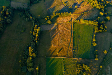 Aerial of beautiful sunset over agricultural fields.