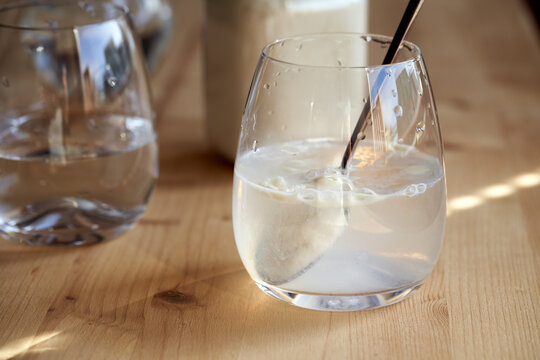 Preparation of a healthy protein drink - mixing whey protein powder with water