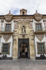 Architectural fragments of Baroque Palacio de la Merced in Cordoba Plaza de Colon. Palacio de la Merced built in XVIII century; it was monastery of Mercedarian monks. Andalusia, Cordoba, Spain.