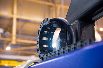 Plastic cable chain of electrical wires in the machine