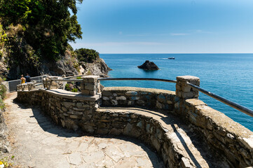 Monterosso, Liguria, Italy, June 2020. La via dell'amore panoramic path that connects the Cinque Terre: an amazing corner of coast with crystal clear waters and wild nature. Beautiful summer day.