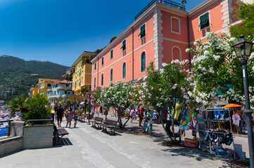 Monterosso, Liguria, Italy. June 2020. The promenade offers a pleasant view of the beaches with the bathing establishments and the surrounding nature. Beautiful summer day