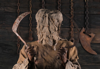 burlap scarecrow with black halloween background