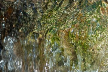 Mountain cold crystal clear brook in Swiss Alps