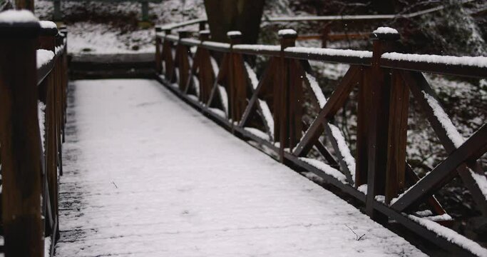 snowy wooden bridge under the magical snow fall