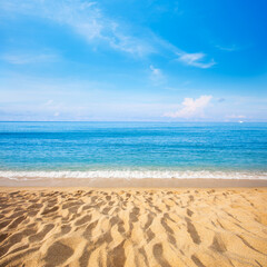Fototapeta na wymiar Sandy beach and beautiful tropical sea