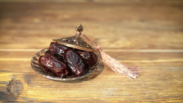 Putting nuts into Arabian juice of jallab served in holy month ramadan