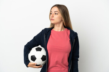 Young woman over isolated white background with soccer ball