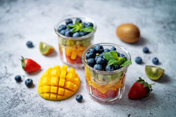 Rainbow fruit salad in a glass