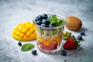 Rainbow fruit salad in a glass