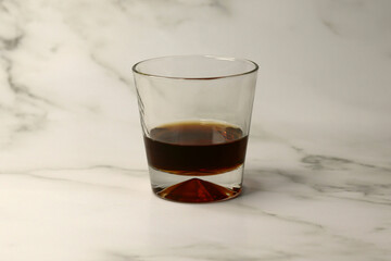 alcoholic drink in a glass on a white background