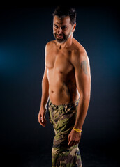 Fototapeta premium Healthy muscular young man on a dark background