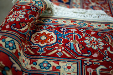 Beautiful oriental patterns and ornaments on a Persian rug in Iran - 426760849