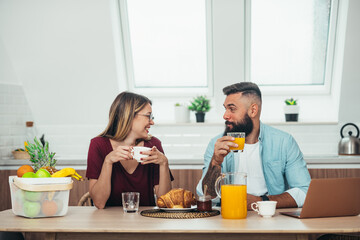 Couple having breakfast at home