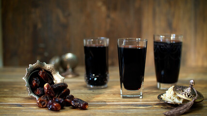 Arabian juice of jallab served in the holy month of Ramadan with nuts and dates