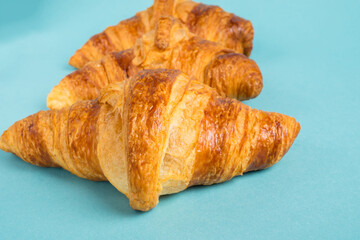 Continental breakfast with gold french croissants and cup of tea