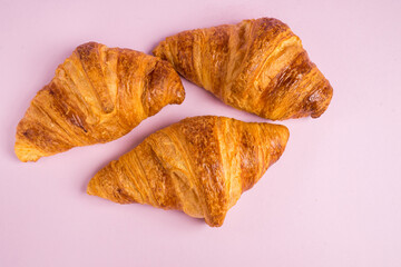 Continental breakfast with gold french croissants fruits and cup of tea