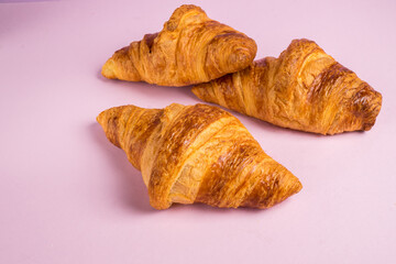 Continental breakfast with gold french croissants fruits and cup of tea