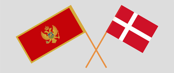 Crossed flags of Montenegro and Denmark. Official colors. Correct proportion