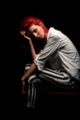 Fototapeta na wymiar Beautiful redhead female model