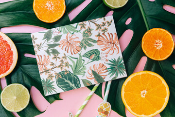 Flat Lay Summer tropical background. Workspace with supplies and fresh fruits. Top view, copy space