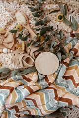 Flat lay composition with cute baby items in basket. The concept of awaiting baby, pregnancy