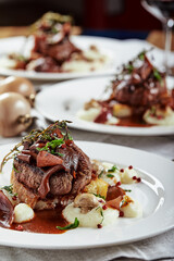 Gourmet appetizer: Beautifully decorated catering banquet foie gras with berries © Georgii