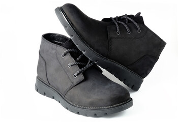 Black suede chukka boots isolated on white. 