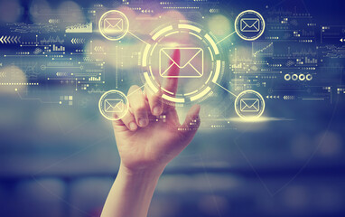 Email concept with a hand pressing a button