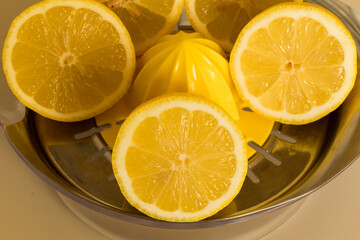 Fototapeta na wymiar sliced lemons, and a manual juicer