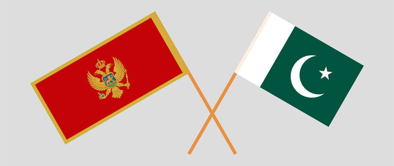 Crossed flags of Montenegro and Pakistan. Official colors. Correct proportion