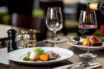 Lojrom (Whitefish roe) Swedish dish served at the restaurant with wine