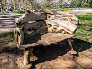 Wooden bench. Interesting sculptured structure.
