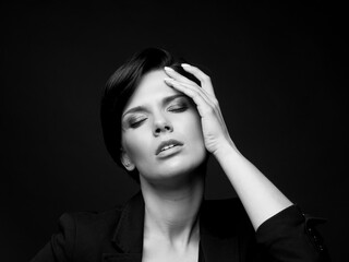 Black and white photo of beautiful woman in studio