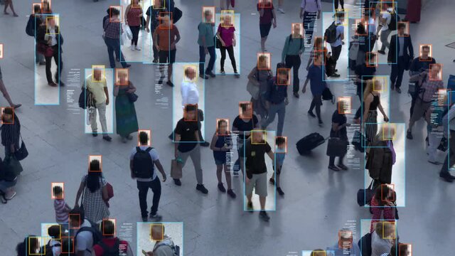 Crowded building with commuters walking. Artificial intelligence and facial recognition are used for surveillance purposes.  Deep learning. Futuristic technology.